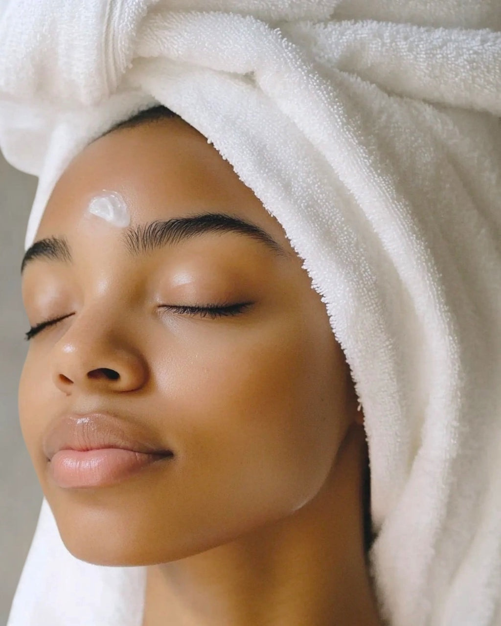 Hand-poured Skin Pure candles by Jireh’s Glow Studio arranged in a minimalist setting, showcasing the Wild Flower, Lavender, Moss, and Heather scents