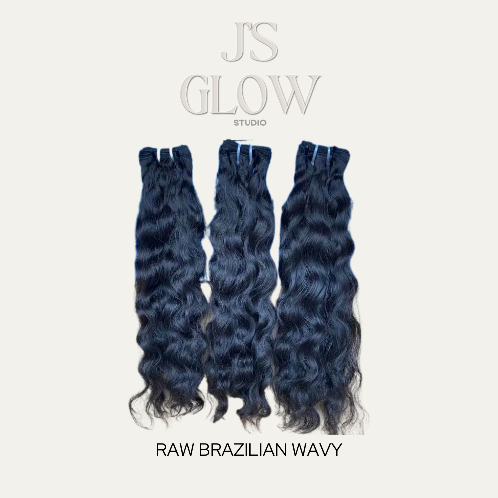 Premium Raw Brazilian Wavy Bundles with natural shine and soft, bouncy waves from Jireh’s Glow Studio.