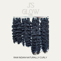 Raw Indian naturally curly hair bundles with tight curls, natural volume, and soft texture from Jireh’s Glow Studio.
